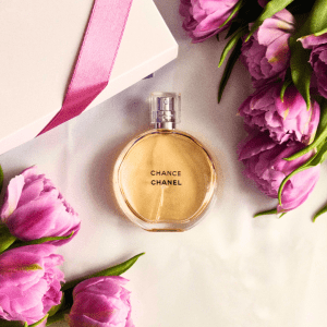 A bottle of Chanel Chance perfume as a gift, with a gift box and roses.